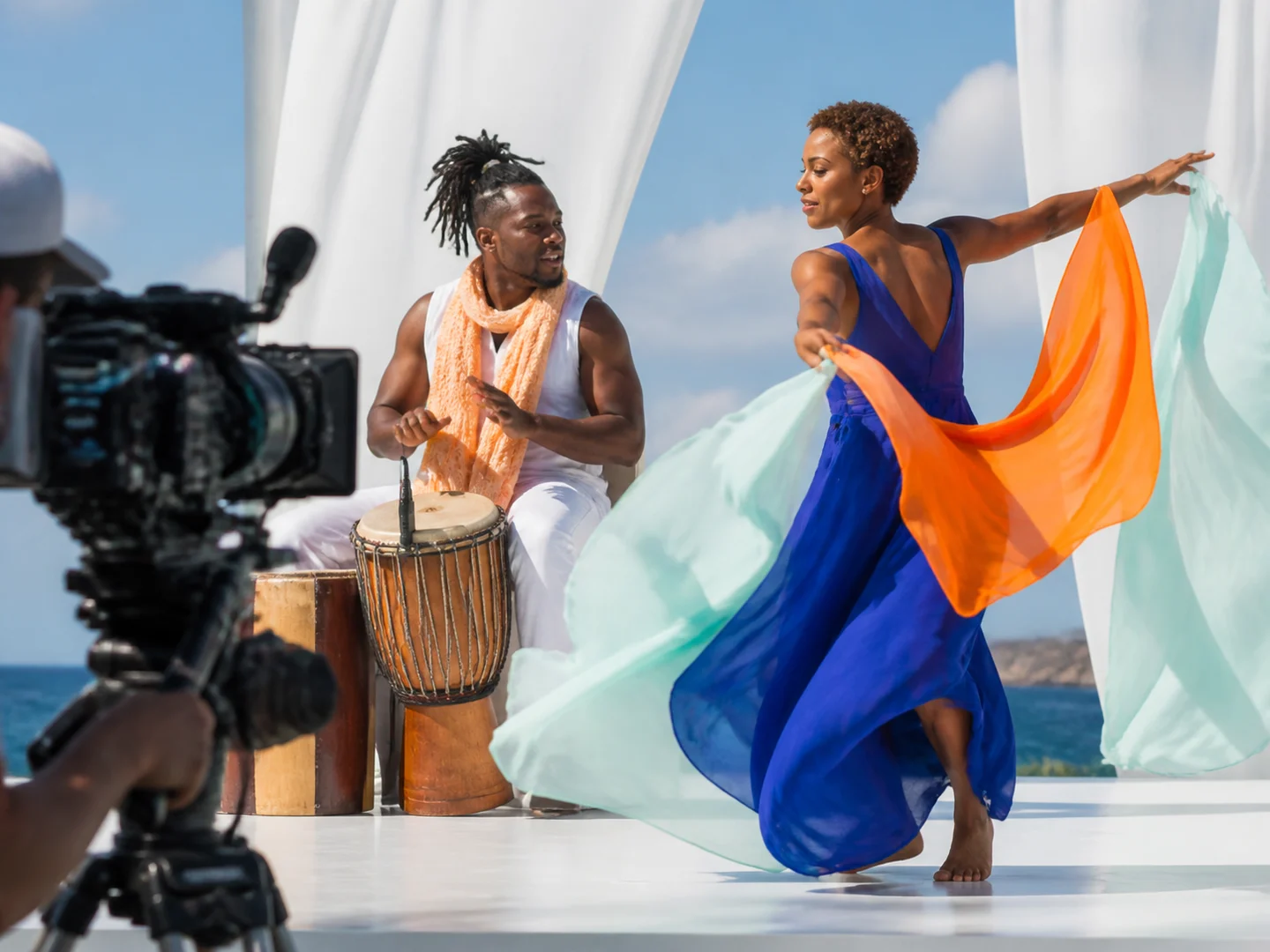 A percussionist and dancer performing for a cinema camera
